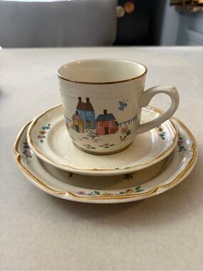 International Cream Ceramic Cup and Saucer Set with Hand-Painted Village Design